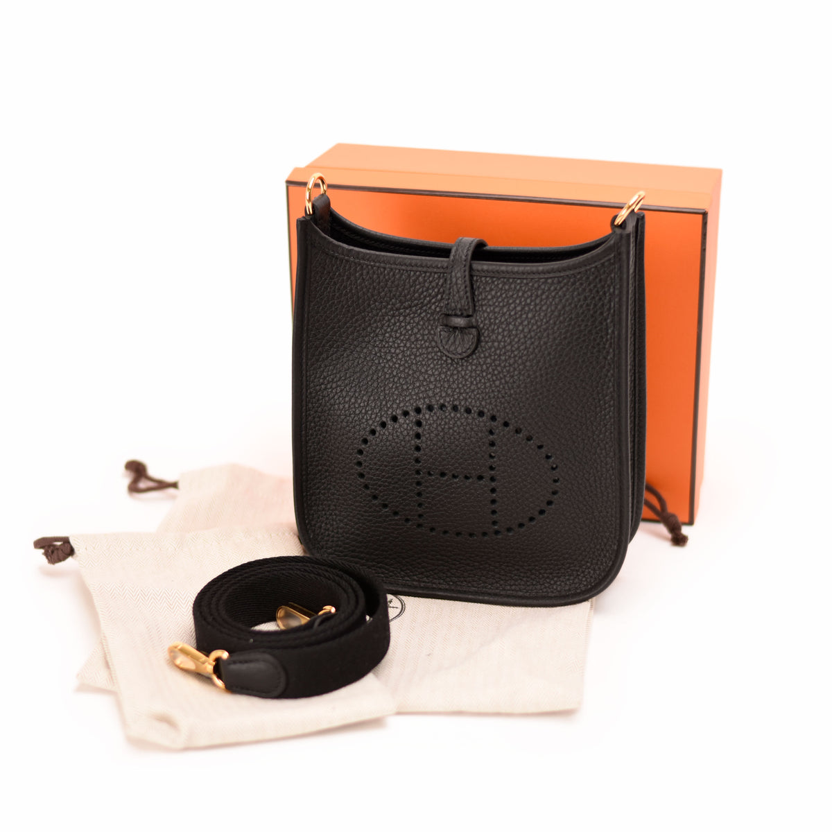 Black leather Hermès crossbody bag with embossed H logo. curated Pre-loved Luxury by Myluxe in Helsinki.