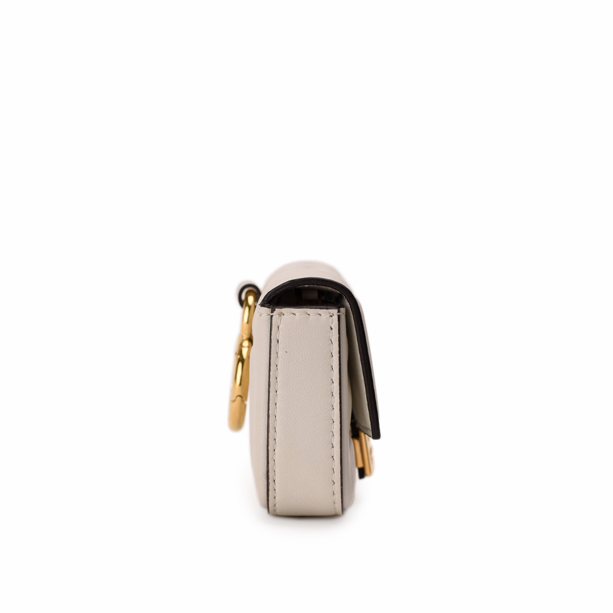 Side view of a grey leather luxury handbag with gold hardware, curated Pre-loved Luxury by Myluxe in Helsinki.