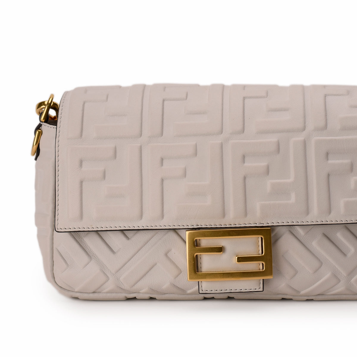 Beige Fendi leather shoulder bag with FF embossed pattern and gold clasp, curated Pre-loved Luxury by Myluxe in Helsinki.