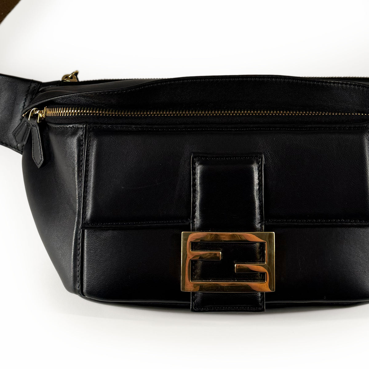 Black leather waist bag with gold-tone Fendi logo hardware, curated Pre-loved Luxury by Myluxe in Helsinki.