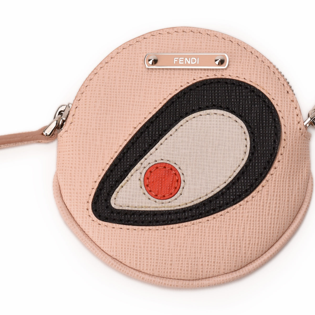 Fendi round pink leather coin purse with black and beige graphic design. curated Pre-loved Luxury by Myluxe in Helsinki.