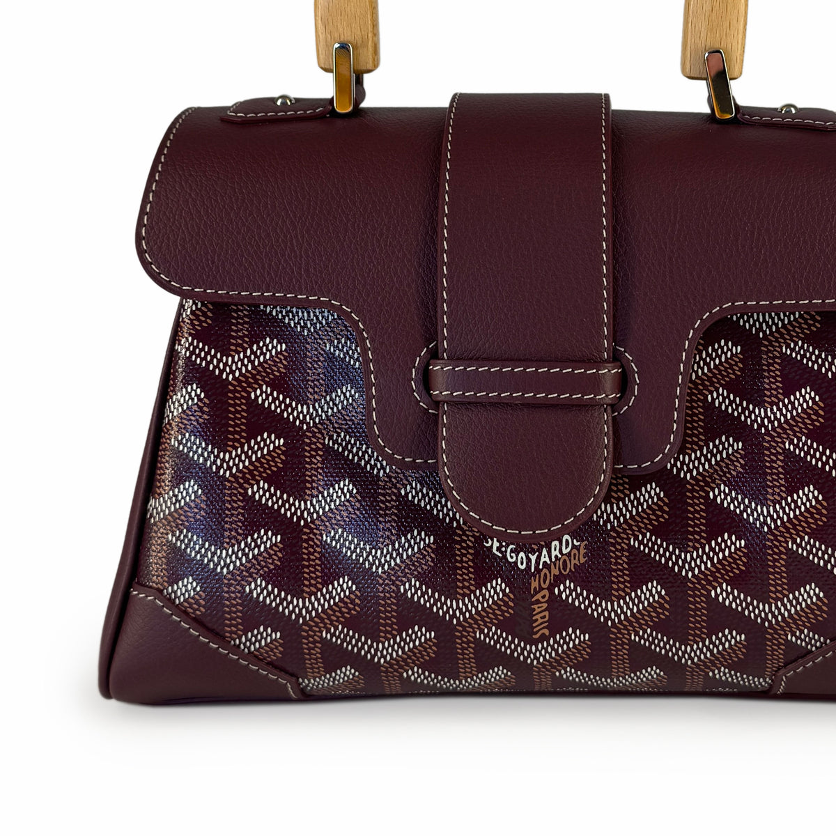 Burgundy Goyard patterned leather handbag with wooden handles, curated Pre-loved Luxury by Myluxe in Helsinki.