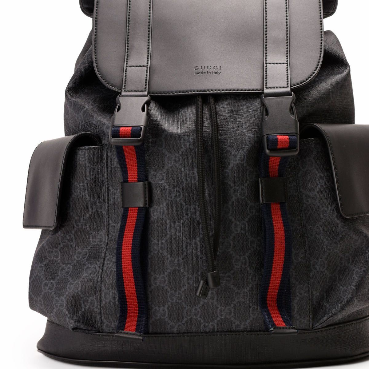 Black Gucci monogram canvas backpack with red and navy web stripe detail, curated Pre-loved Luxury by Myluxe in Helsinki.
