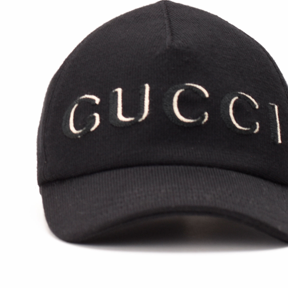 Black Gucci knit baseball cap with white logo embroidery, curated Pre-loved Luxury by Myluxe in Helsinki.