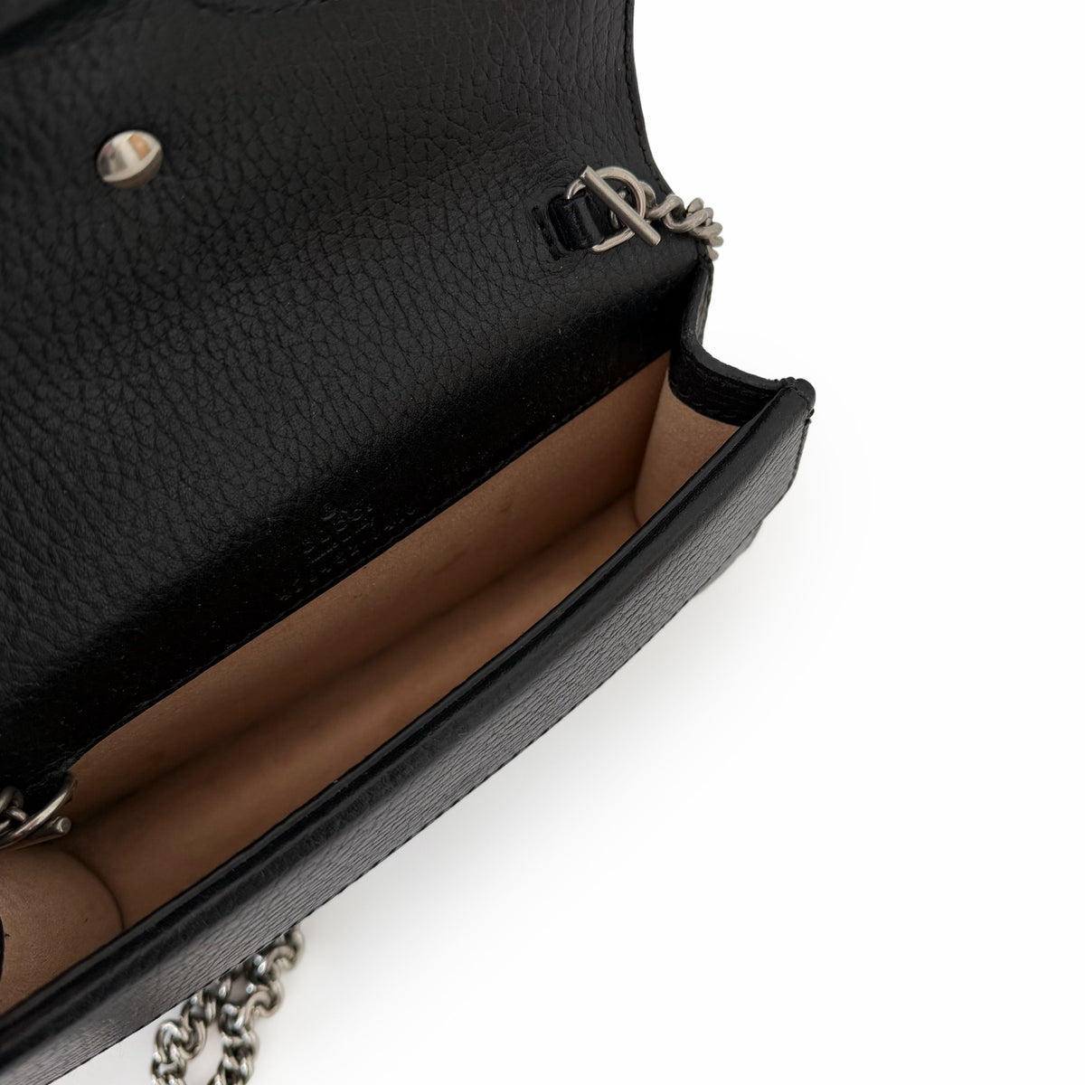 Black pebbled leather crossbody bag with silver chain strap, curated Pre-loved Luxury by Myluxe in Helsinki.