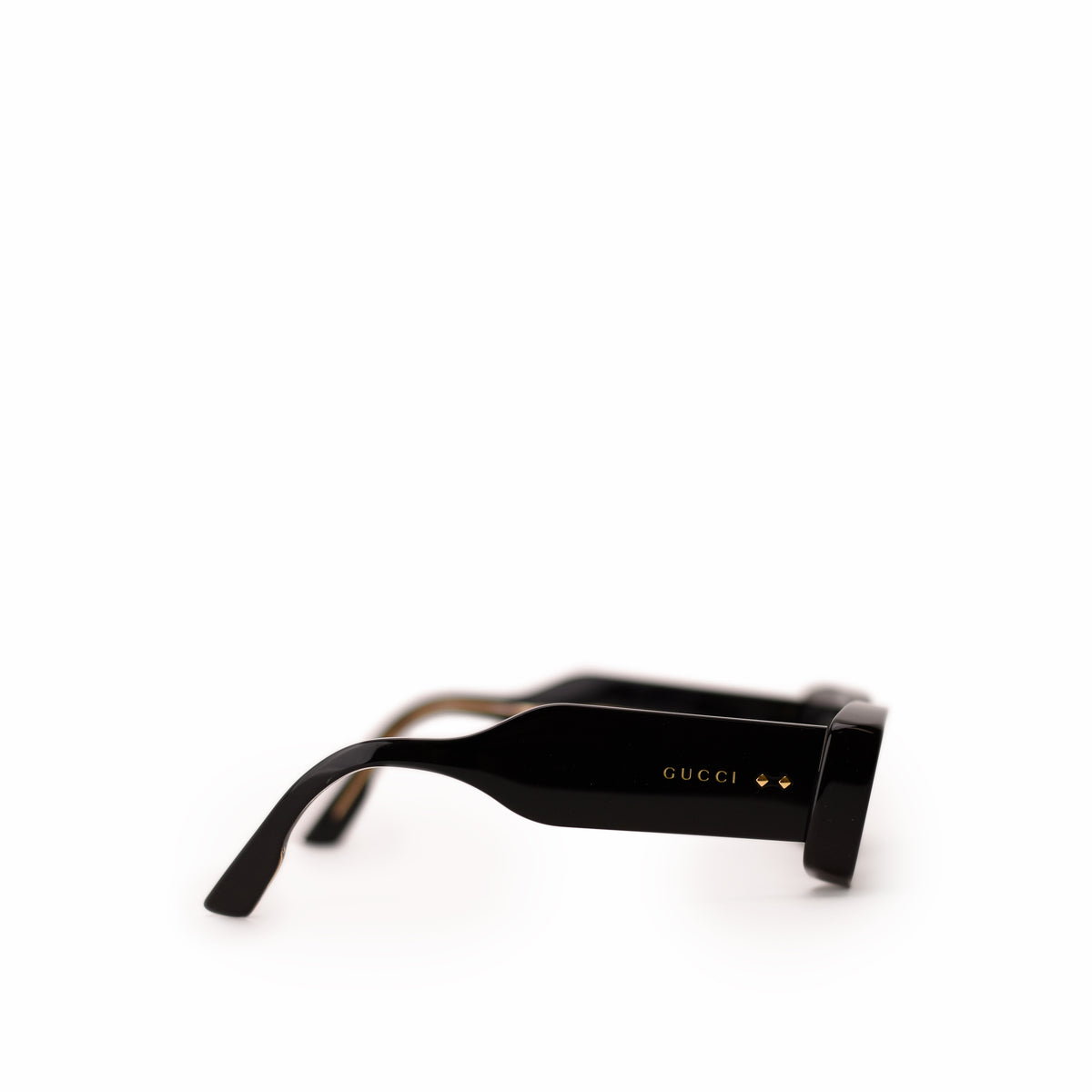 Black Gucci rectangular sunglasses with gold logo detail. curated Pre-loved Luxury by Myluxe in Helsinki.