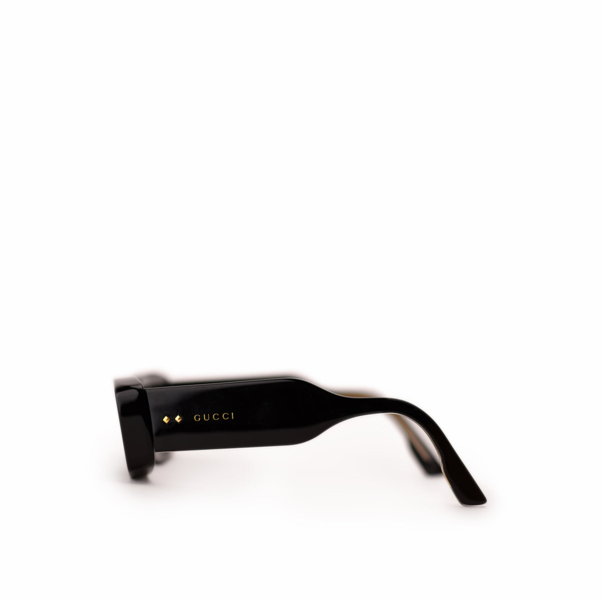 Black Gucci rectangular sunglasses with gold logo detail. curated Pre-loved Luxury by Myluxe in Helsinki.