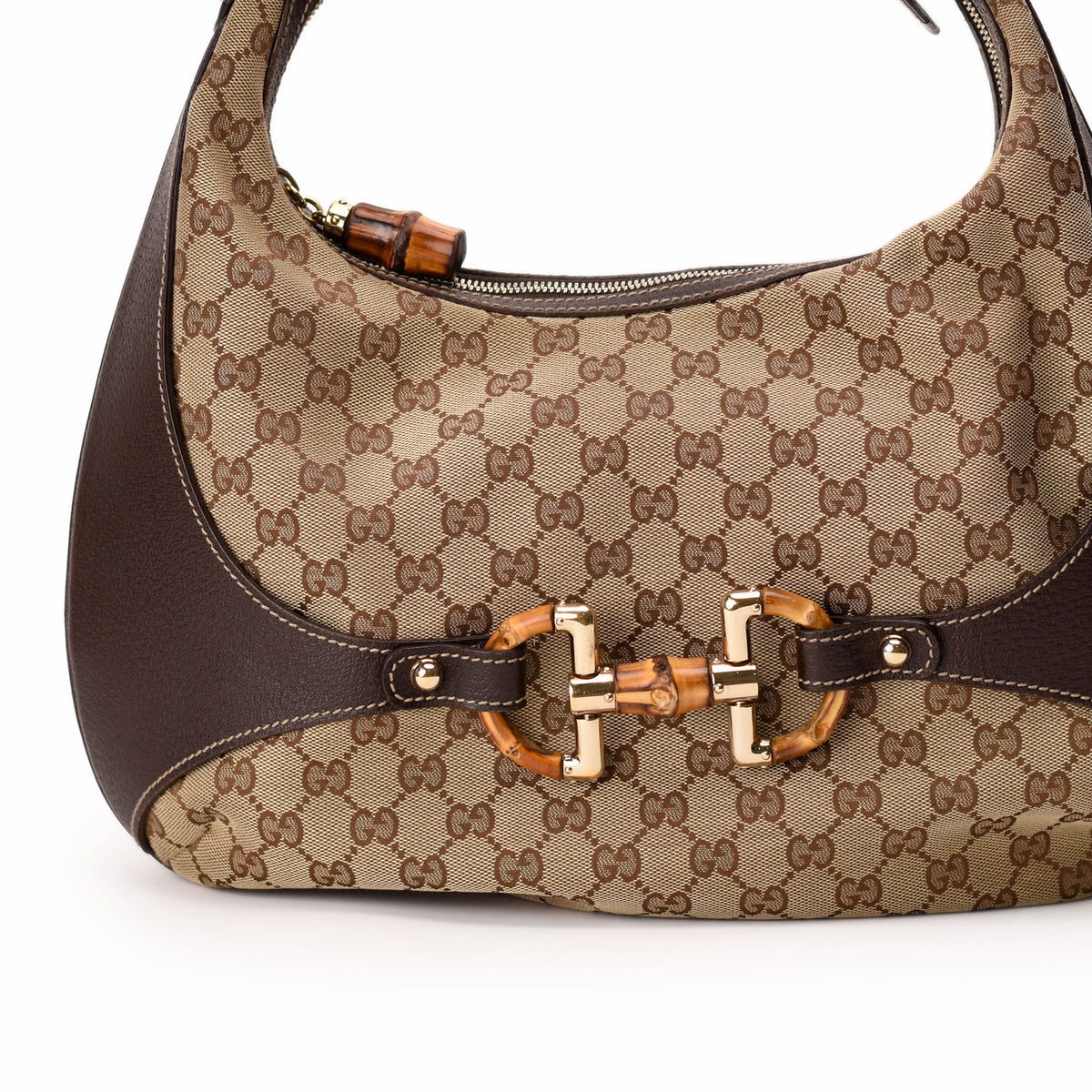 Gucci brown canvas hobo bag with bamboo handle and gold hardware. curated Pre-loved Luxury by Myluxe in Helsinki.