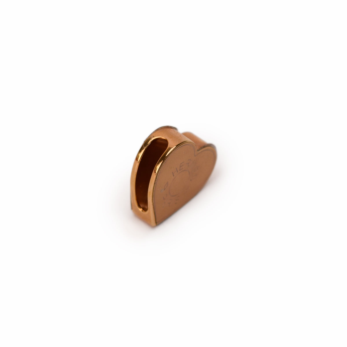 Hermès gold-tone metal heart-shaped charm. Curated Pre-loved Luxury by Myluxe in Helsinki.