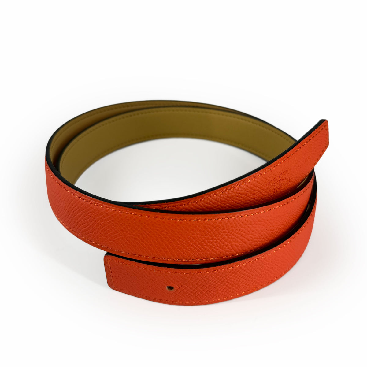 Orange pebbled leather belt with tan lining, curated Pre-loved Luxury by Myluxe in Helsinki.