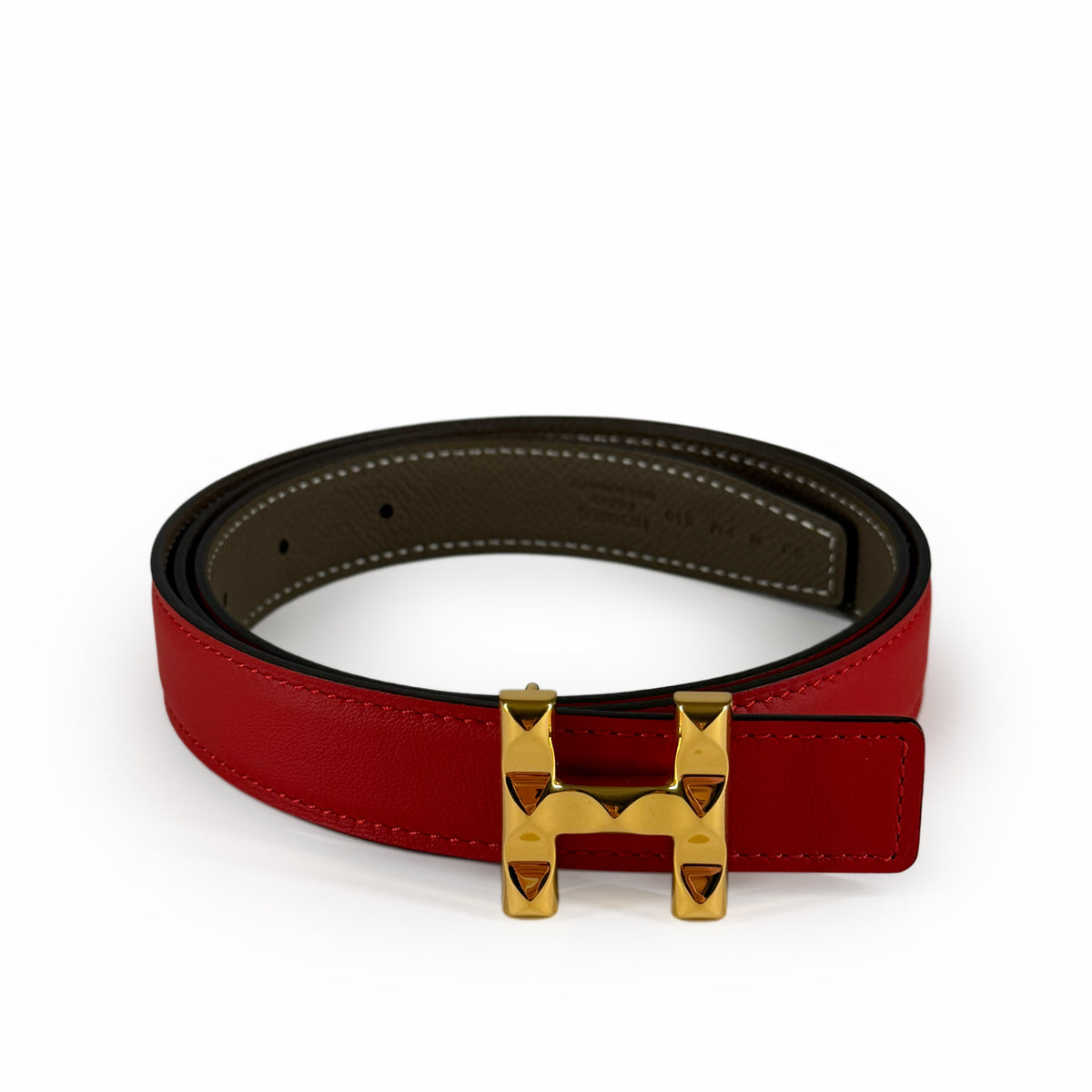 Red leather belt with a gold-tone H-shaped buckle, curated Pre-loved Luxury by Myluxe in Helsinki.