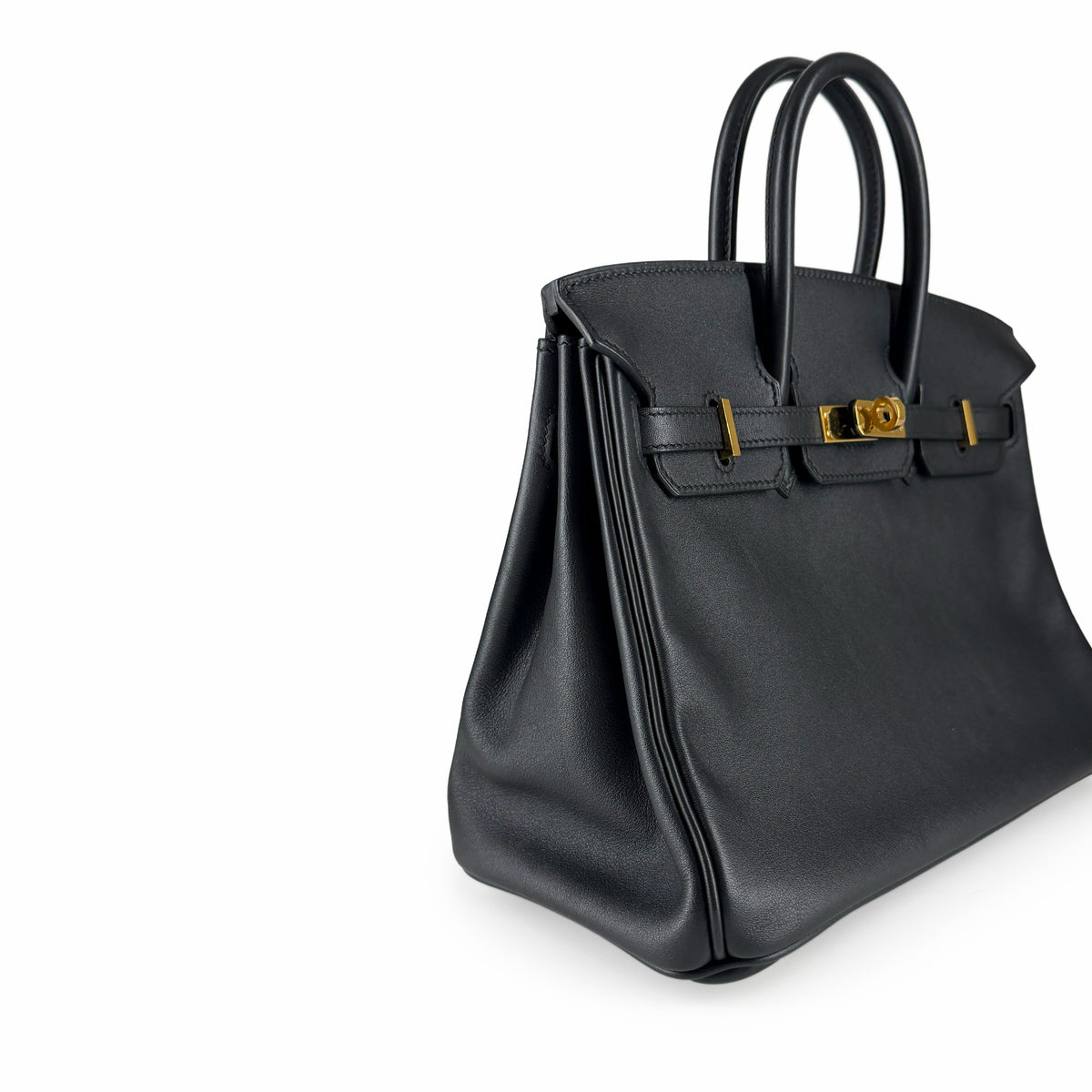 Black grained leather luxury handbag with gold-tone hardware, curated Pre-loved Luxury by Myluxe in Helsinki.