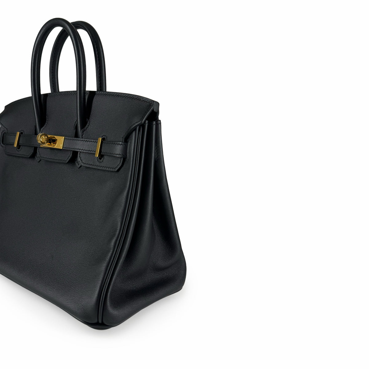 Black grained leather luxury handbag with gold-tone hardware, curated Pre-loved Luxury by Myluxe in Helsinki.