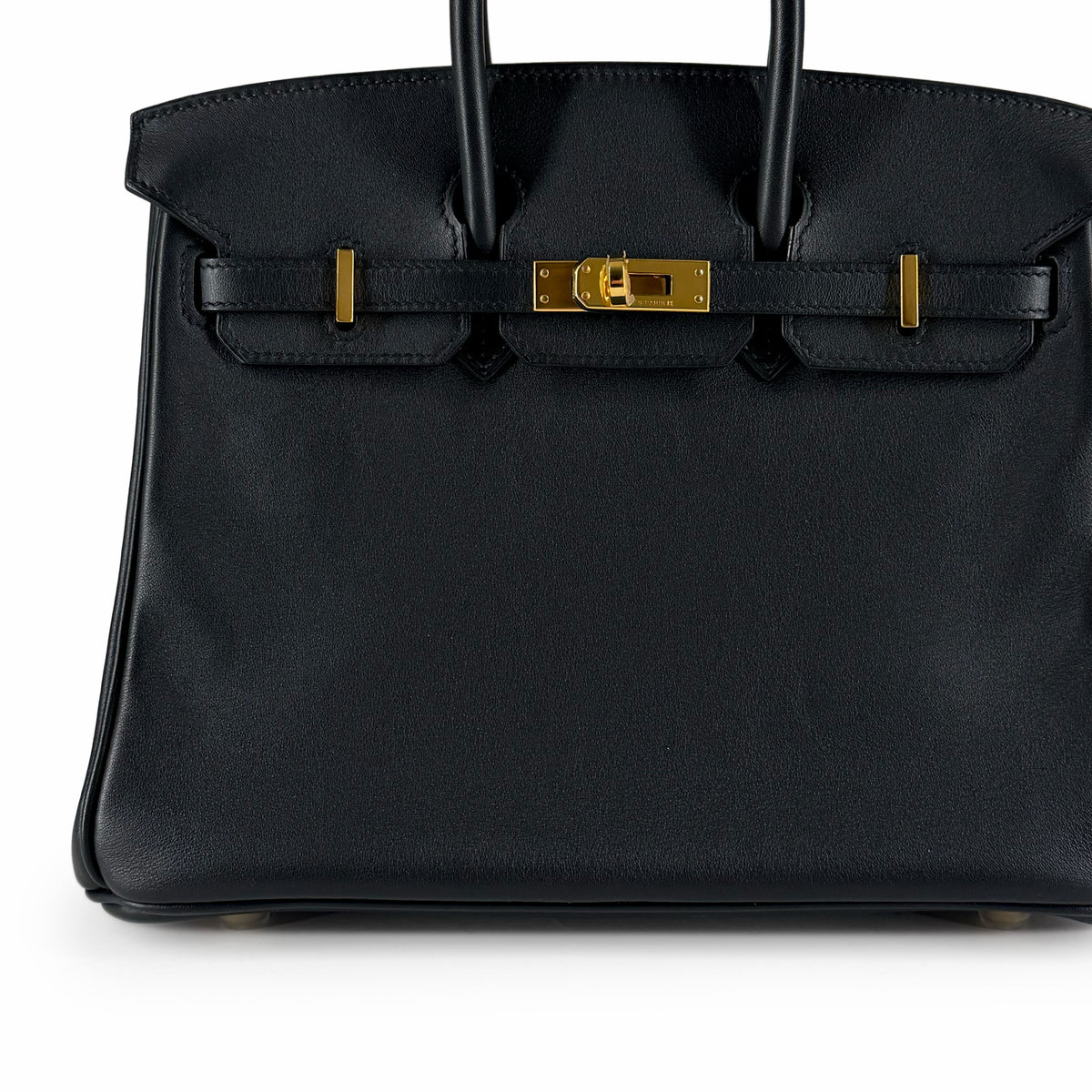Black leather luxury handbag with gold-tone hardware, curated Pre-loved Luxury by Myluxe in Helsinki.