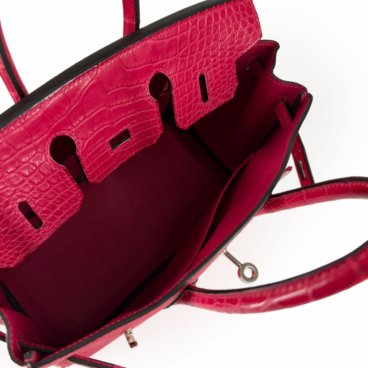 Hermès Birkin 25 handbag in Framboise Touch leather with PHW gold hardware, featuring structured design and signature craftsmanship.