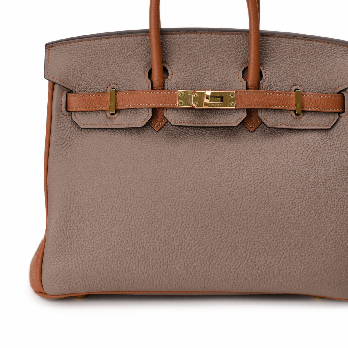 Taupe grained leather Hermès handbag with tan leather straps and gold hardware, curated Pre-loved Luxury by Myluxe in Helsinki.