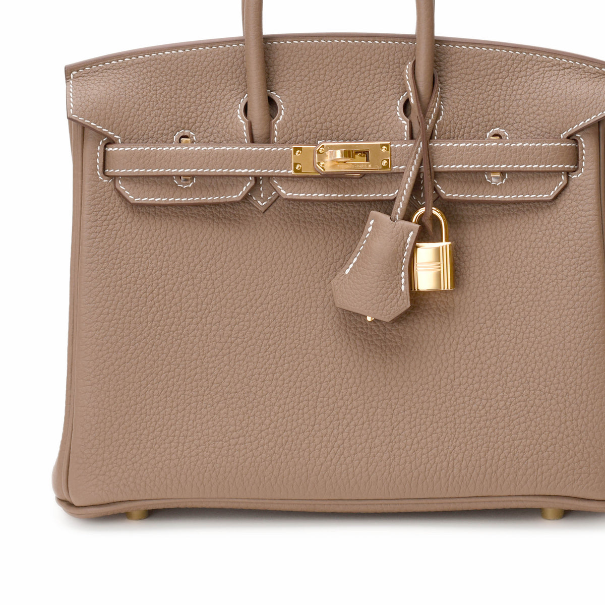 Hermès taupe grained leather handbag with gold-tone hardware and padlock. Curated Pre-loved Luxury by Myluxe in Helsinki.