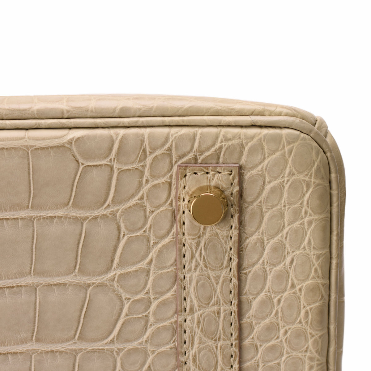 Beige crocodile leather luxury handbag with gold-tone hardware, curated Pre-loved Luxury by Myluxe in Helsinki.