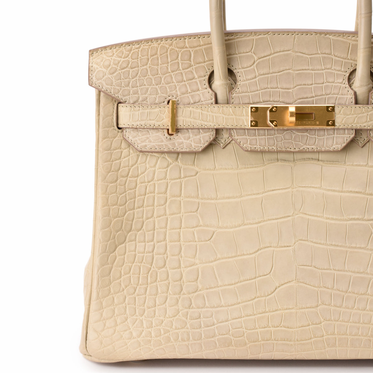 Cream crocodile leather luxury handbag with gold-tone hardware, curated Pre-loved Luxury by Myluxe in Helsinki.
