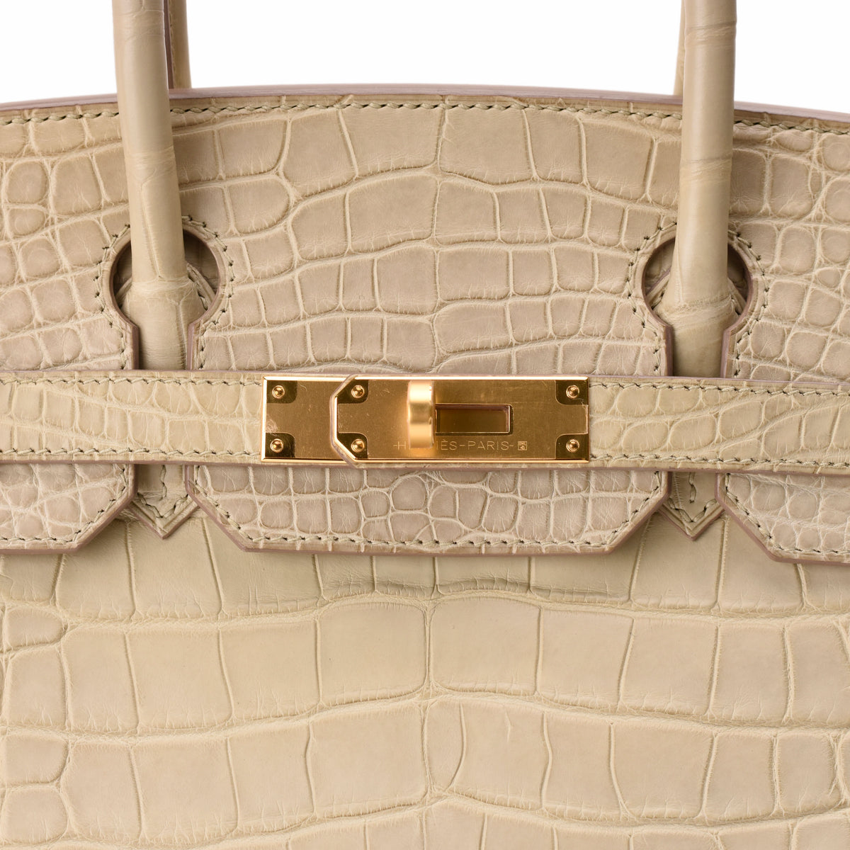 Cream crocodile leather luxury handbag with gold hardware, curated Pre-loved Luxury by Myluxe in Helsinki.