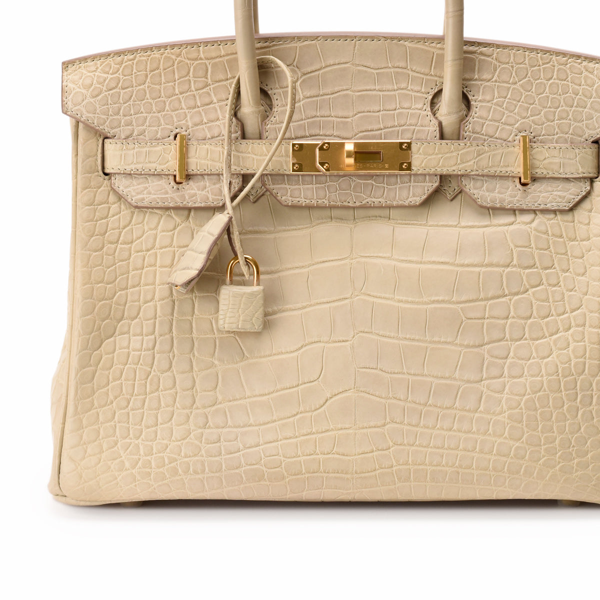 Cream crocodile leather luxury handbag with gold hardware, curated Pre-loved Luxury by Myluxe in Helsinki.
