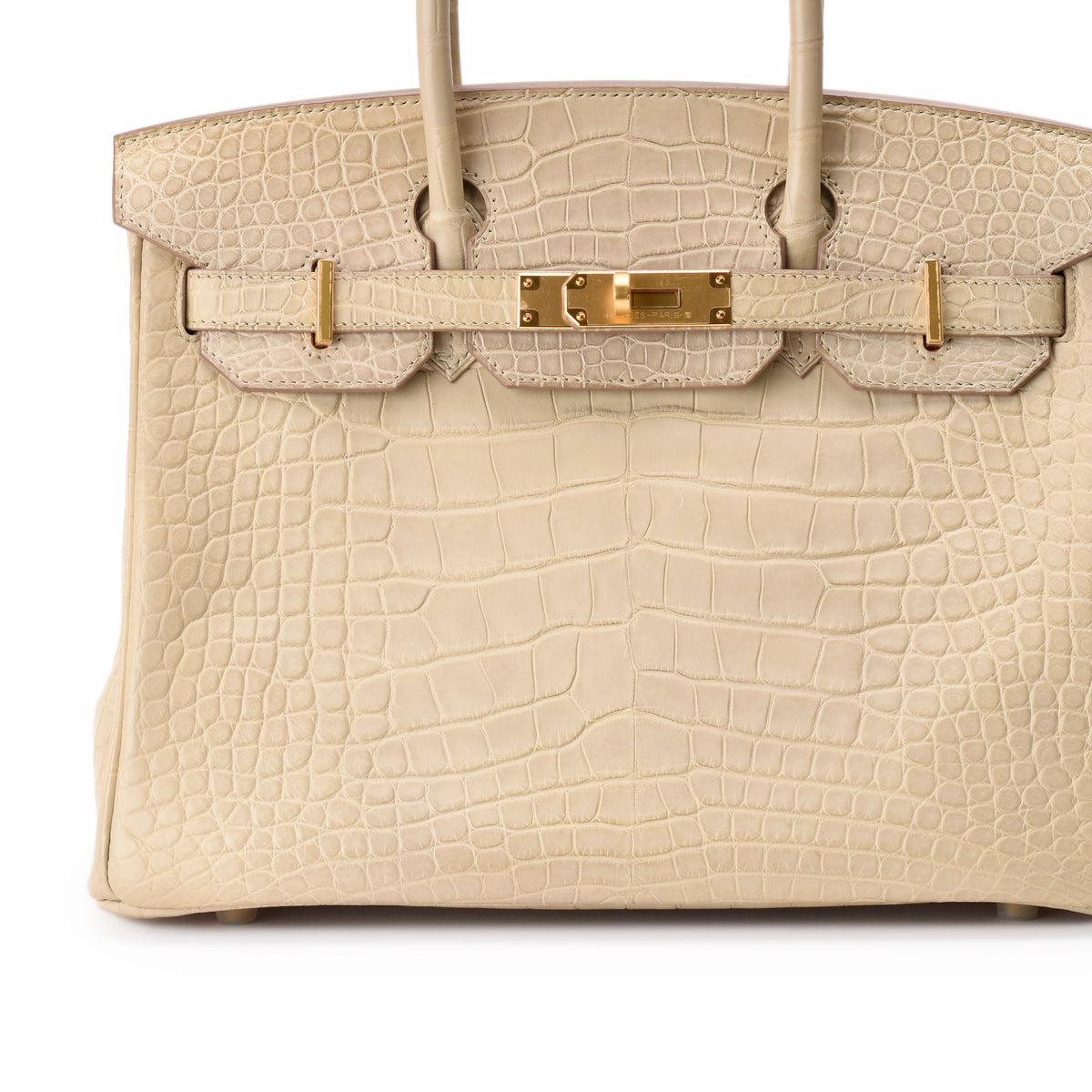 Cream crocodile leather luxury handbag with gold hardware, curated Pre-loved Luxury by Myluxe in Helsinki.