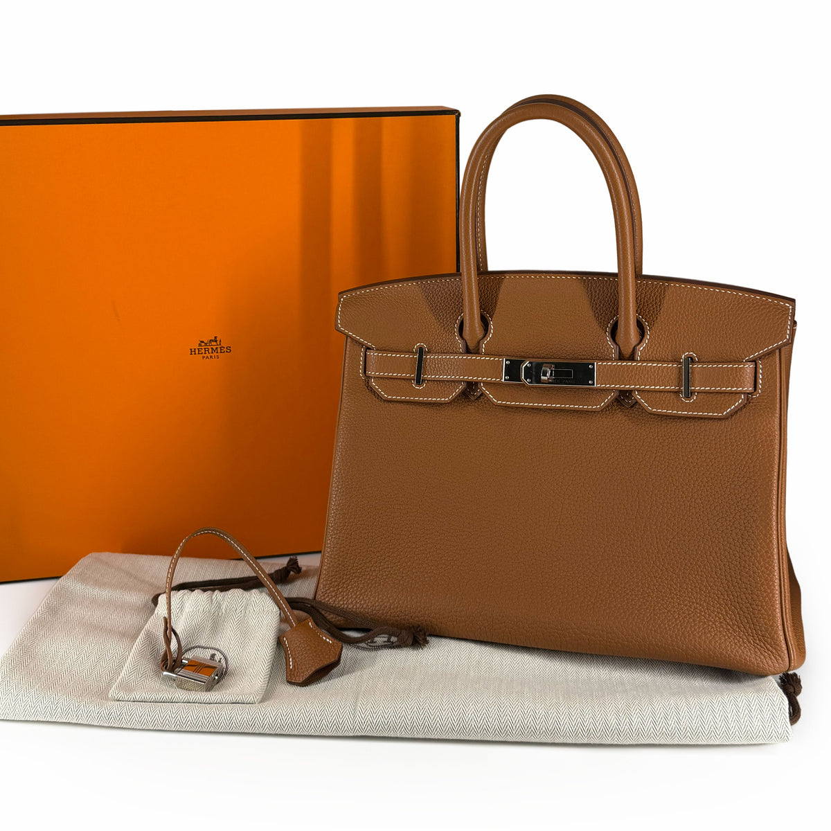 Brown Togo leather Hermès Birkin handbag with silver hardware, curated Pre-loved Luxury by Myluxe in Helsinki.
