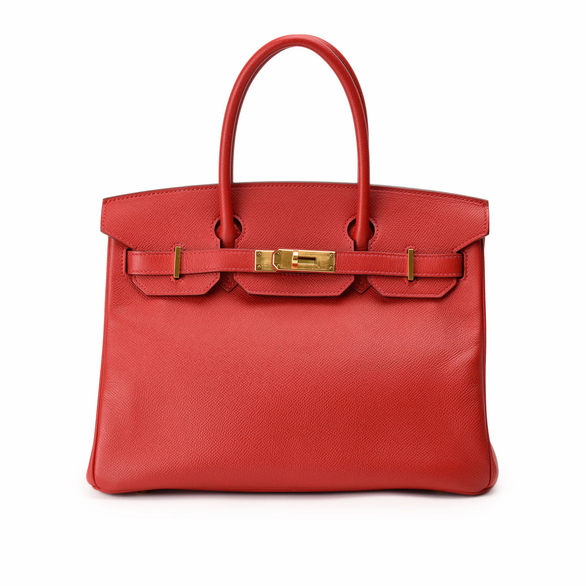 Red Hermès leather handbag with gold-tone hardware. curated Pre-loved Luxury by Myluxe in Helsinki.