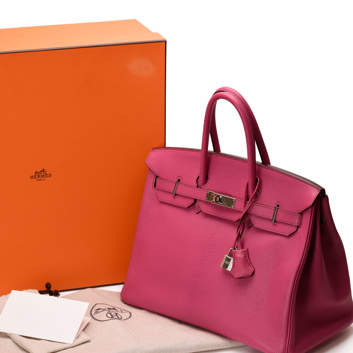 Hermès Birkin 35 Rose Pourpre Togo leather bag with PHW, featuring a structured rectangular shape and top handles.