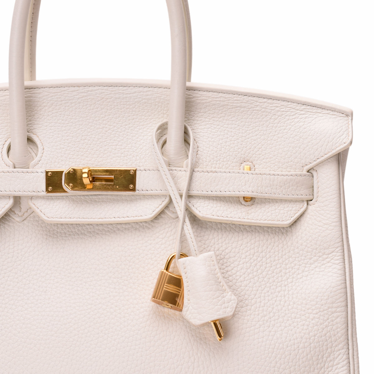 Hermès white grained leather handbag with gold-tone hardware. curated Pre-loved Luxury by Myluxe in Helsinki.