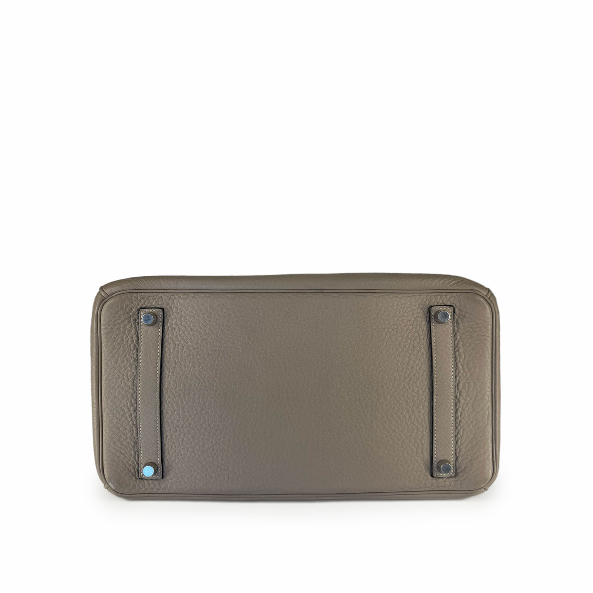 Bottom view of a taupe pebbled leather designer handbag, curated Pre-loved Luxury by Myluxe in Helsinki.
