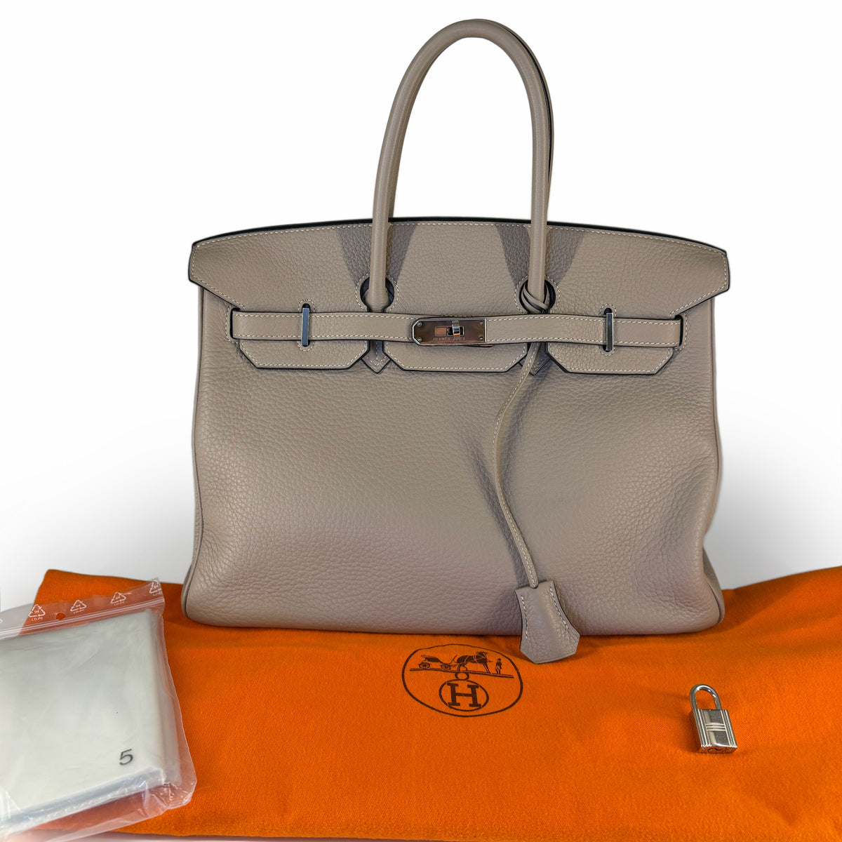 Taupe grained leather Hermès Birkin handbag with silver hardware, curated Pre-loved Luxury by Myluxe in Helsinki.