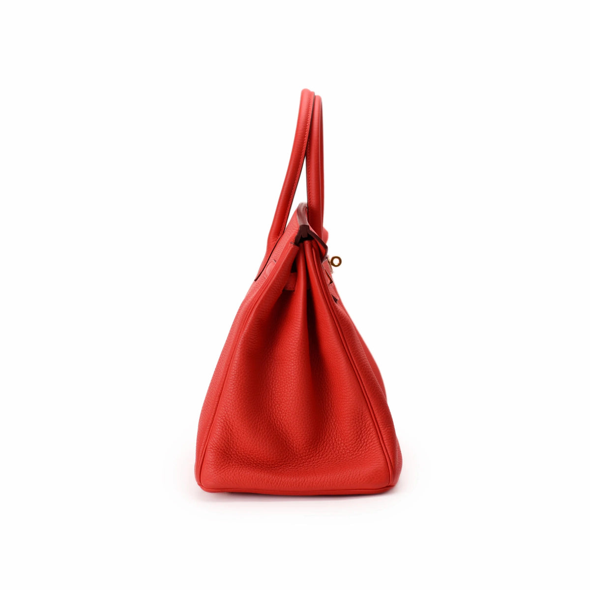 Red grained leather designer handbag with top handles. curated Pre-loved Luxury by Myluxe in Helsinki.