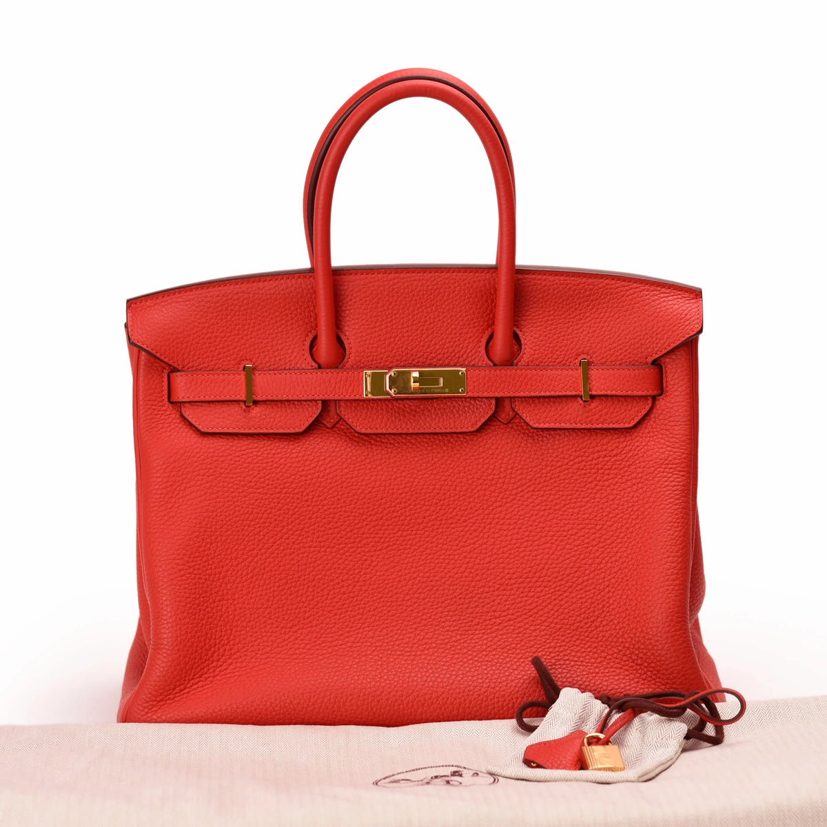 Hermès Birkin handbag in vibrant red grained leather with gold hardware. curated Pre-loved Luxury by Myluxe in Helsinki.