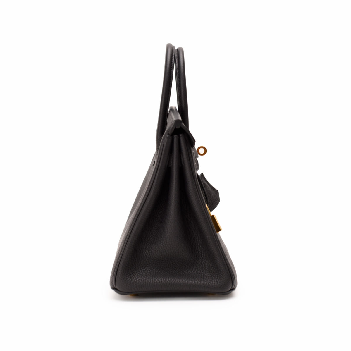 Side view of a black grained leather luxury handbag with gold hardware, curated Pre-loved Luxury by Myluxe in Helsinki.