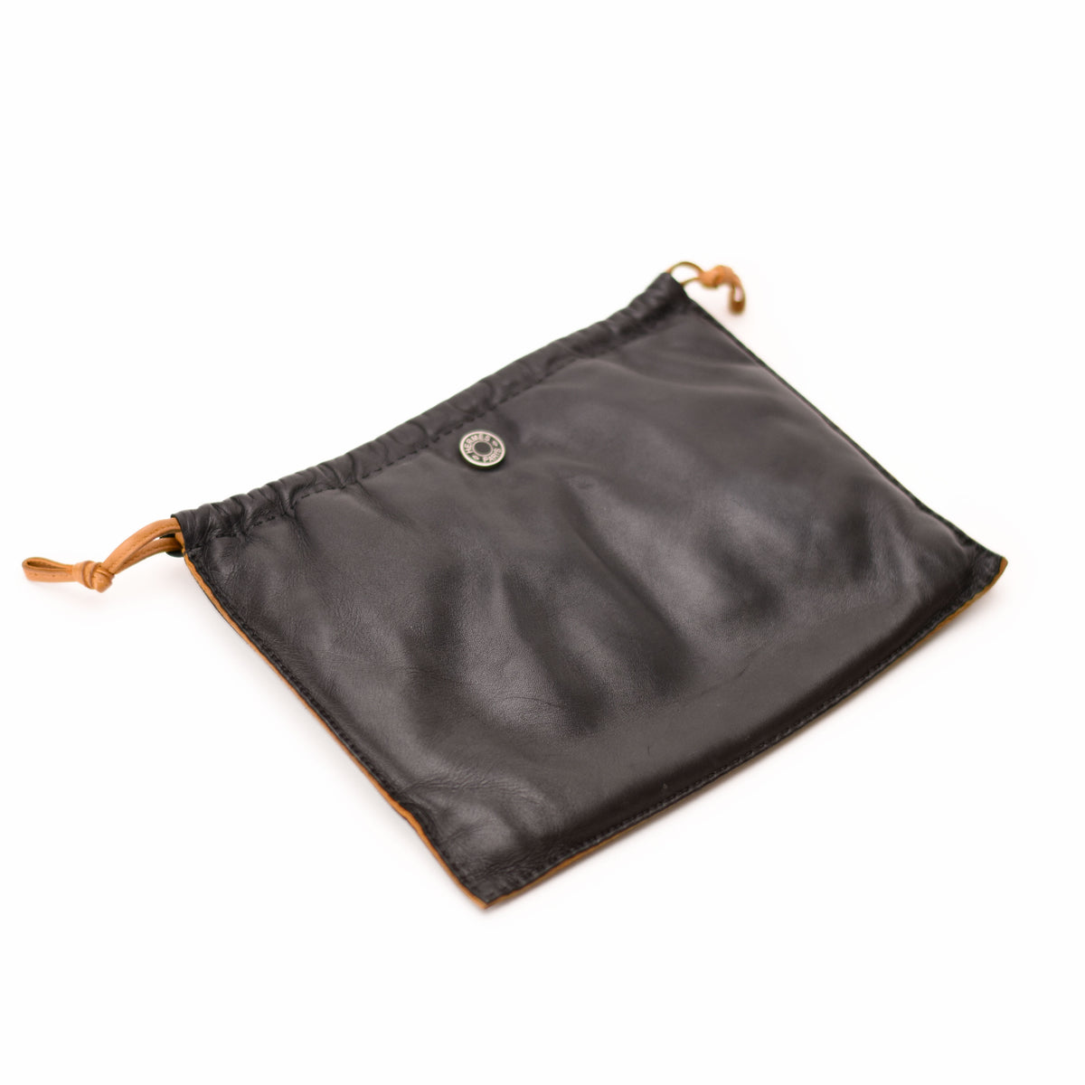 Black leather drawstring pouch with tan trim, curated Pre-loved Luxury by Myluxe in Helsinki.