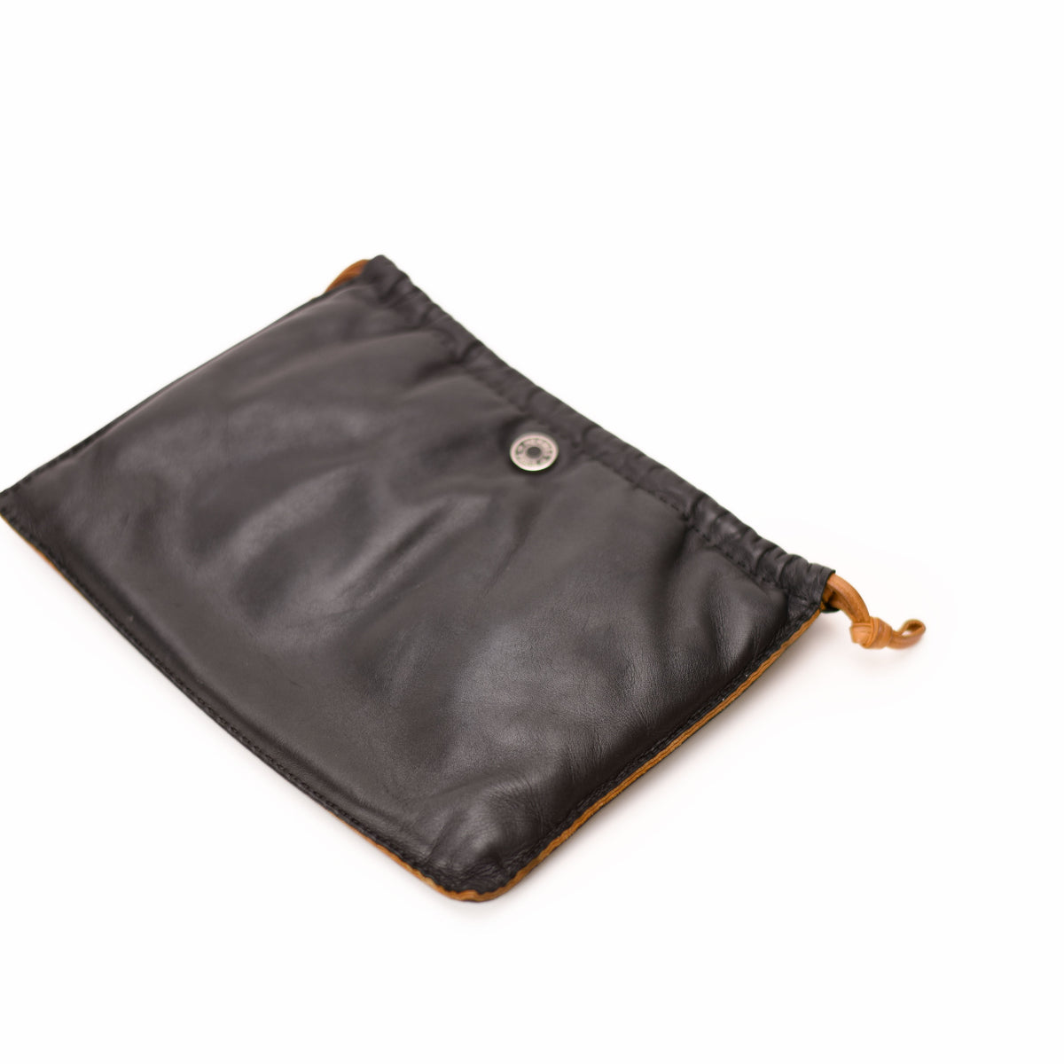 Black leather drawstring pouch with tan lining and silver button closure. curated Pre-loved Luxury by Myluxe in Helsinki.