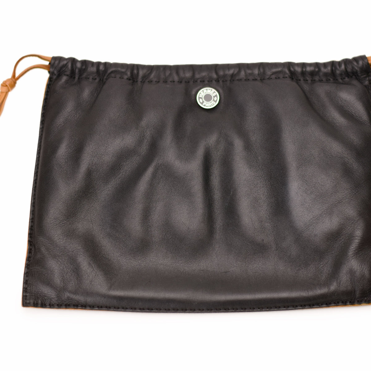 Black leather Hermès dust bag with silver logo detail. curated Pre-loved Luxury by Myluxe in Helsinki.