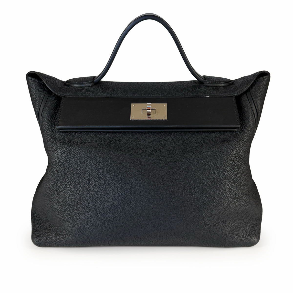 Black grained leather handbag with silver turn-lock closure, curated Pre-loved Luxury by Myluxe in Helsinki.