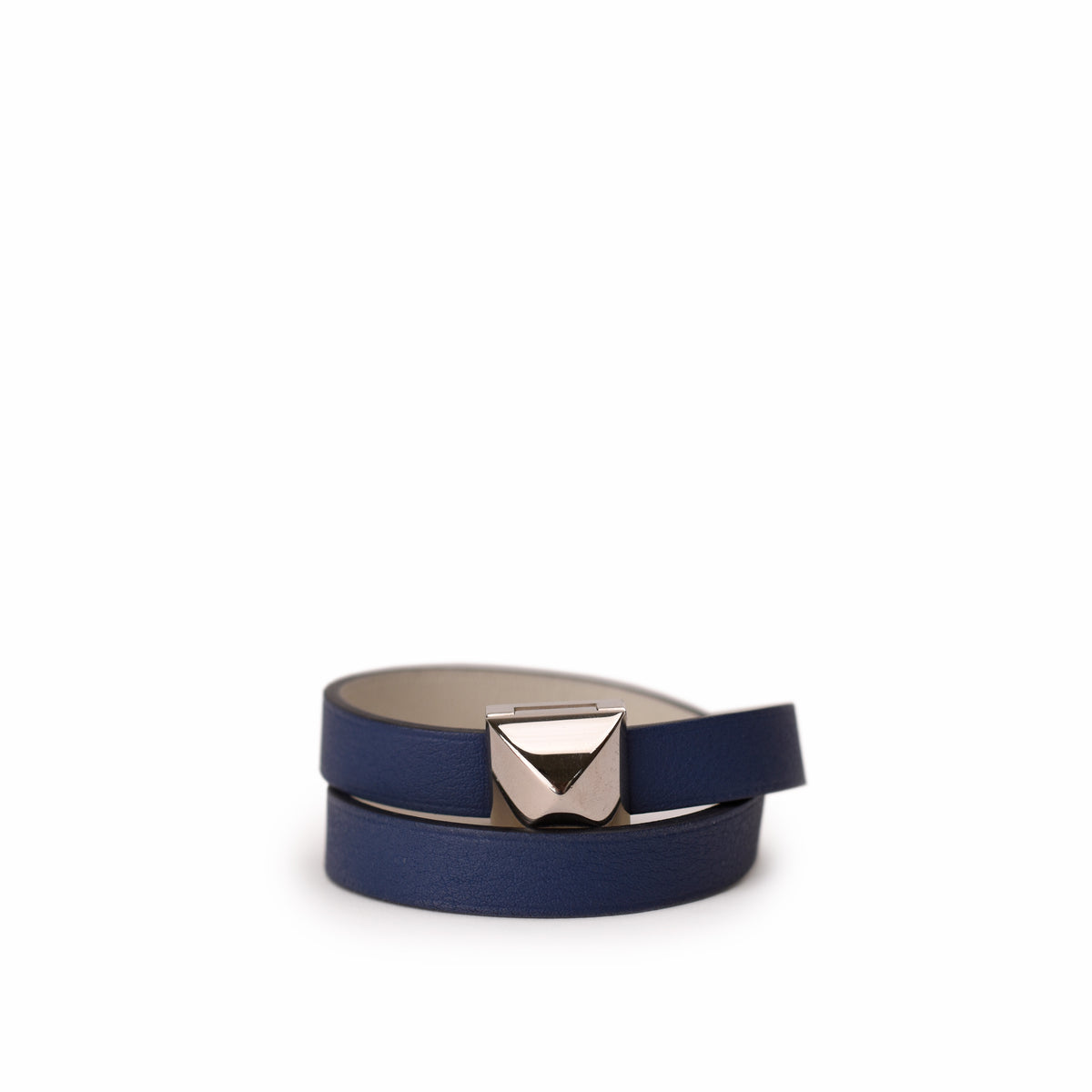 Navy blue leather belt with a silver geometric buckle. curated Pre-loved Luxury by Myluxe in Helsinki.