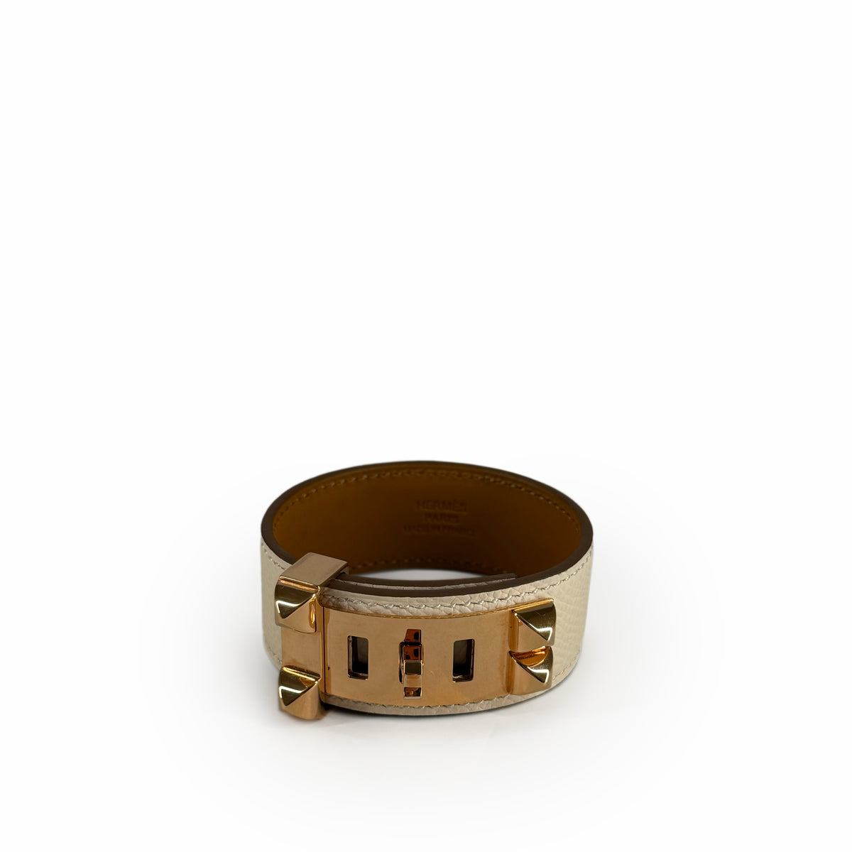 Hermès gold-tone metal and cream leather wide cuff bracelet, curated Pre-loved Luxury by Myluxe in Helsinki.