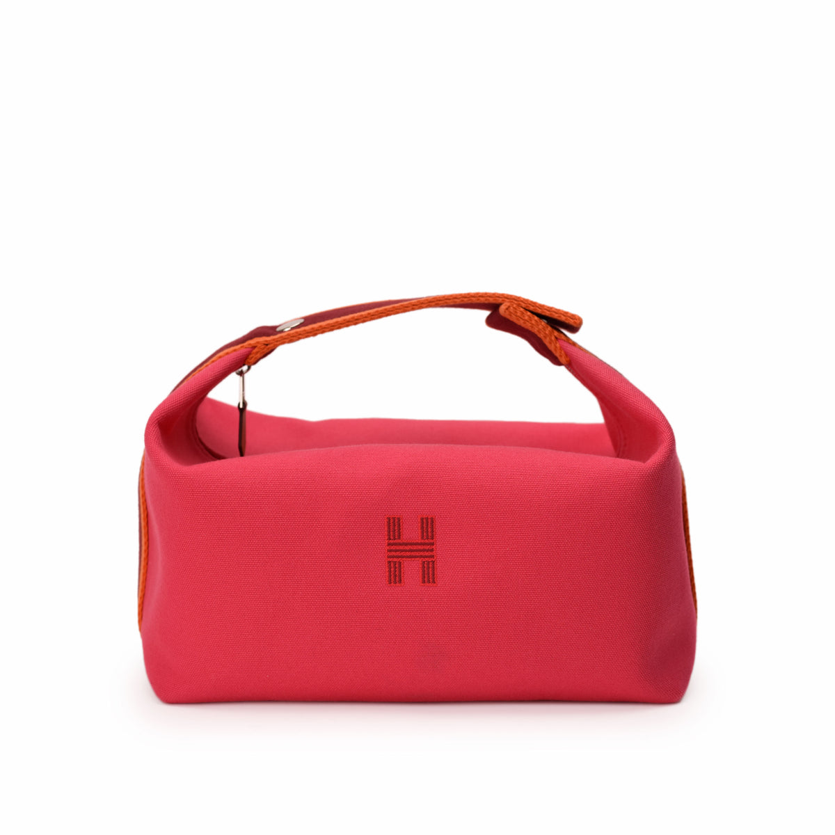 Red canvas Hermès handbag with orange leather handles, curated Pre-loved Luxury by Myluxe in Helsinki.