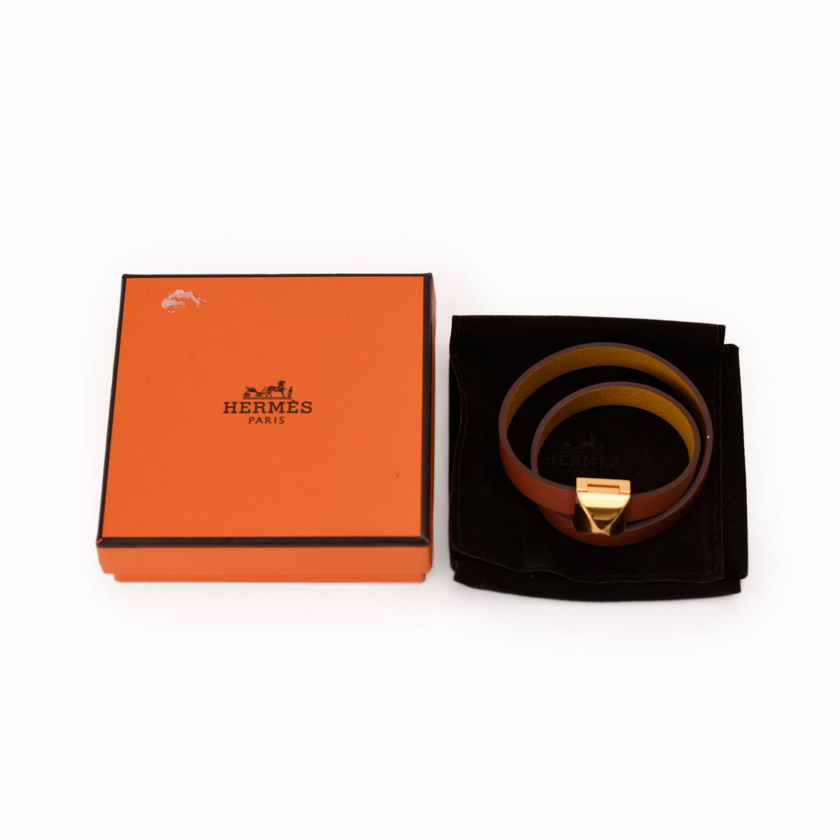 Hermès brown leather belt with gold-tone buckle and orange box. curated Pre-loved Luxury by Myluxe in Helsinki.