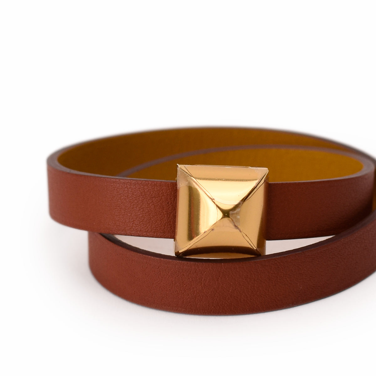 Brown leather belt with a polished gold geometric buckle. curated Pre-loved Luxury by Myluxe in Helsinki.