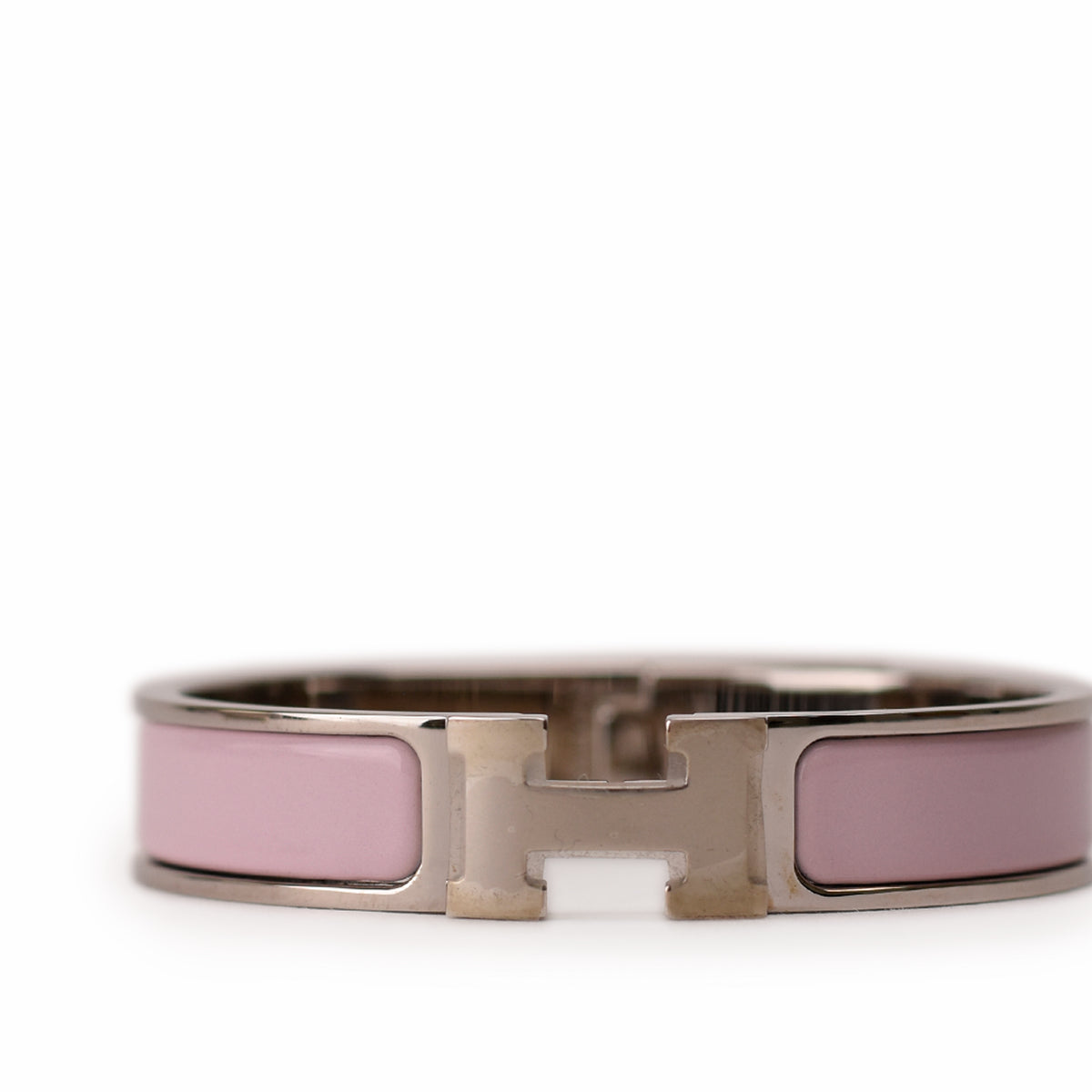 Hermès silver-tone metal and pink enamel H-motif bangle. curated Pre-loved Luxury by Myluxe in Helsinki.