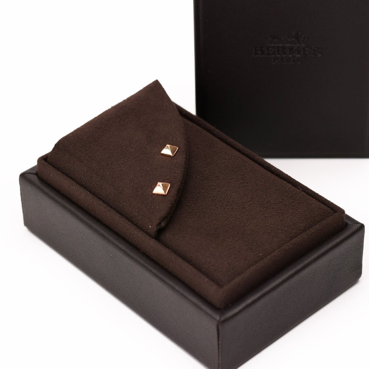 Hermès gold-tone square stud earrings in a brown luxury gift box, curated Pre-loved Luxury by Myluxe in Helsinki.