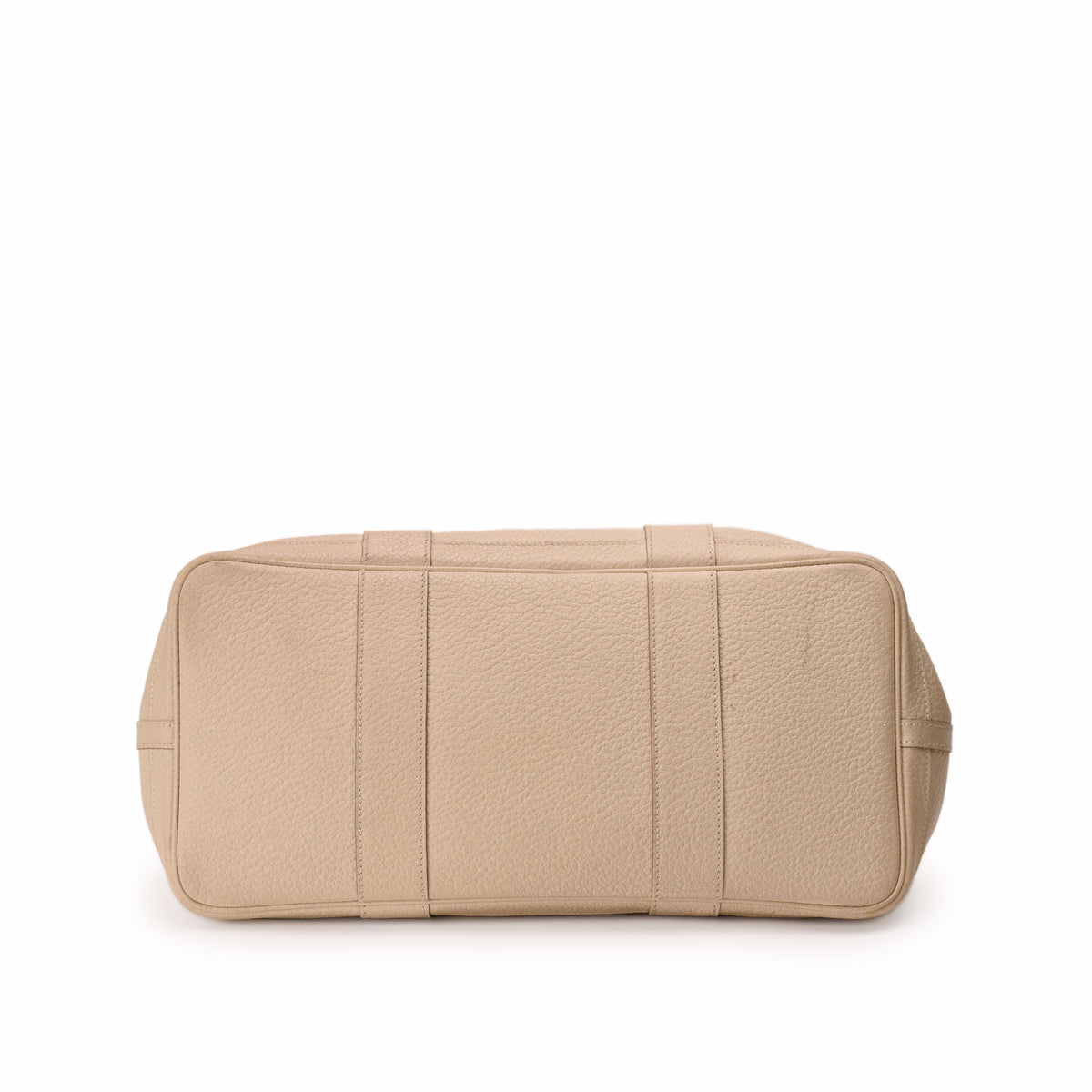 Bottom view of a beige grained leather luxury handbag, curated Pre-loved Luxury by Myluxe in Helsinki.