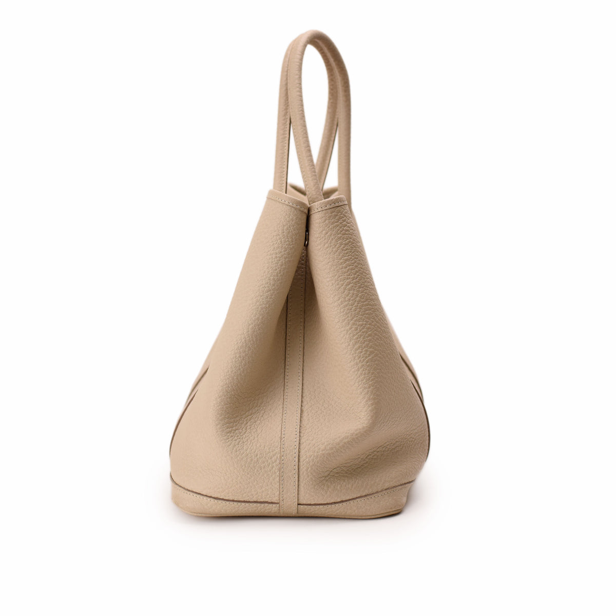 Beige pebbled leather tote bag with slim top handles. curated Pre-loved Luxury by Myluxe in Helsinki.