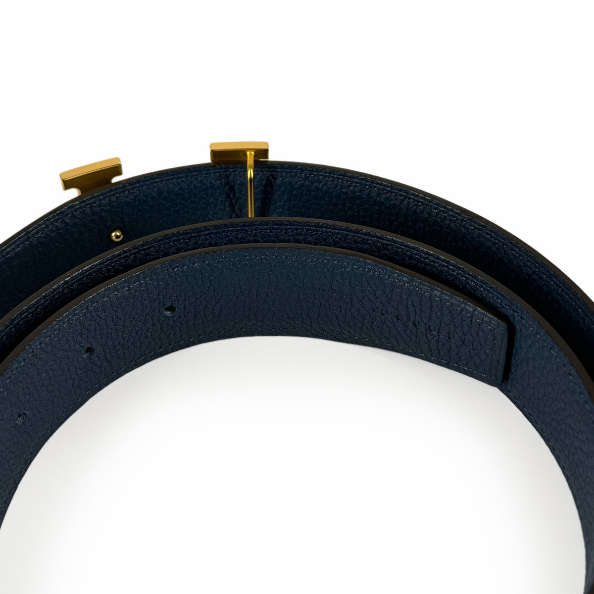 Navy blue textured leather belt with gold-toned buckle, curated Pre-loved Luxury by Myluxe in Helsinki.