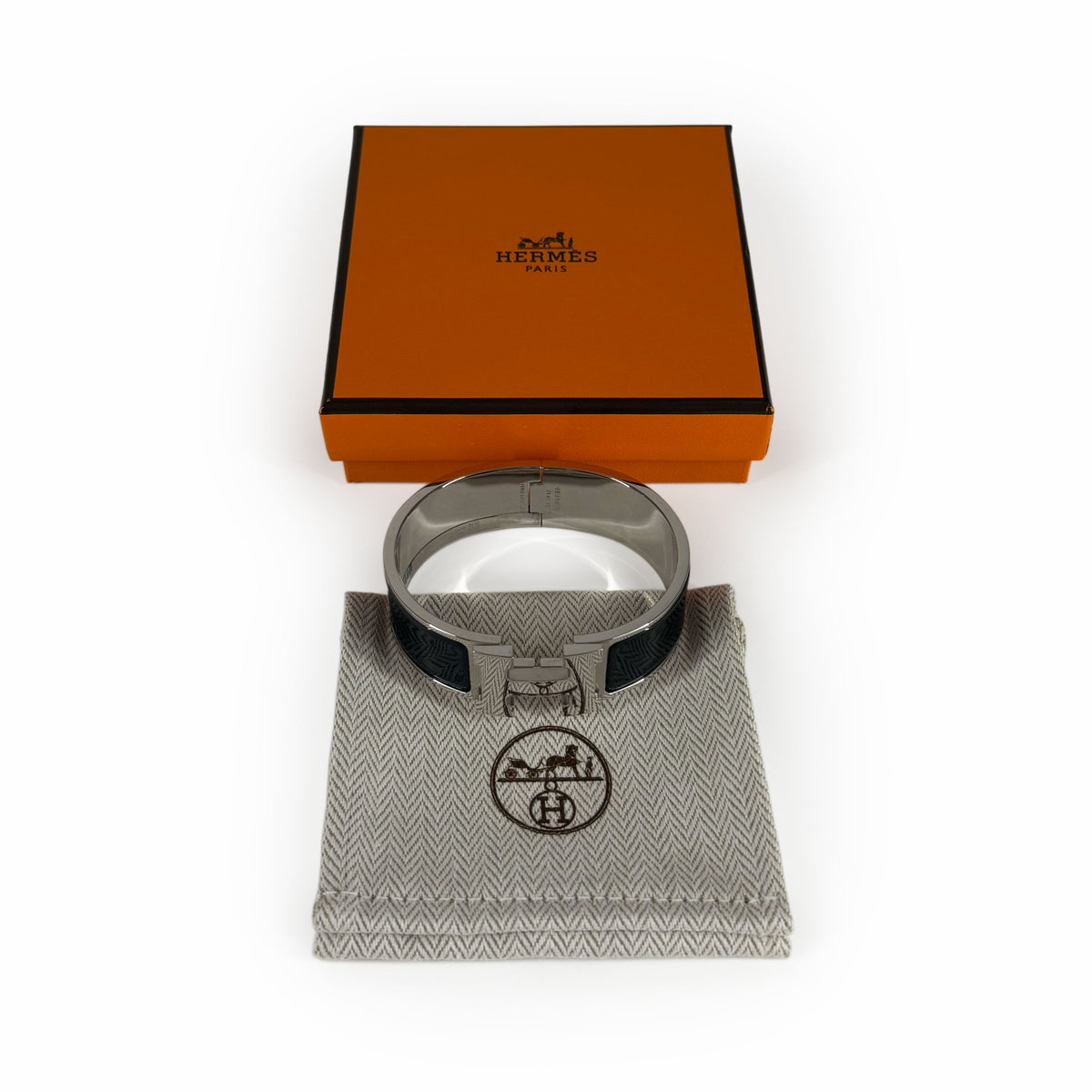 Hermès silver metal cuff bracelet with black enamel, curated Pre-loved Luxury by Myluxe in Helsinki.